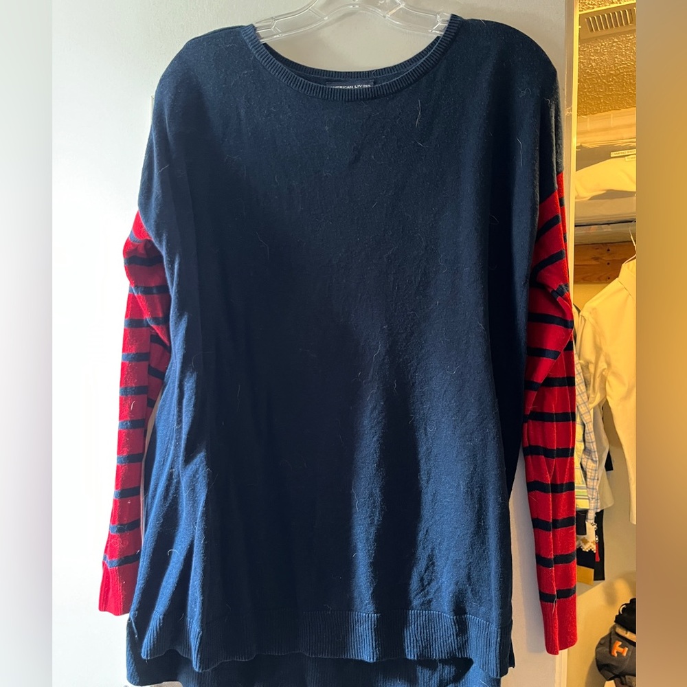 Navy sweater with striped sleeves